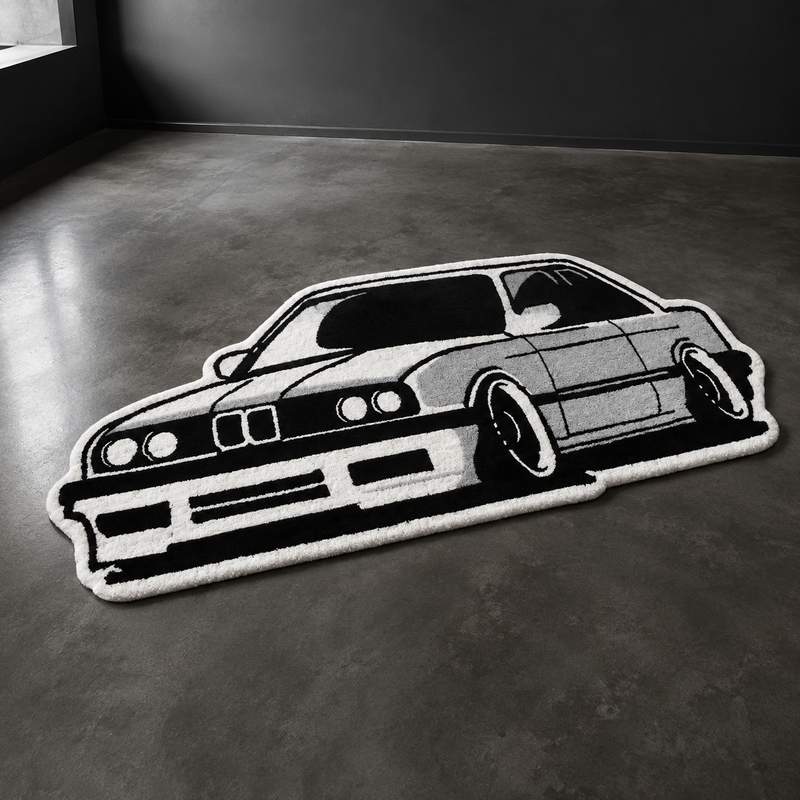 Black and white hand-tufted car rug shaped like a 1980s European coupe